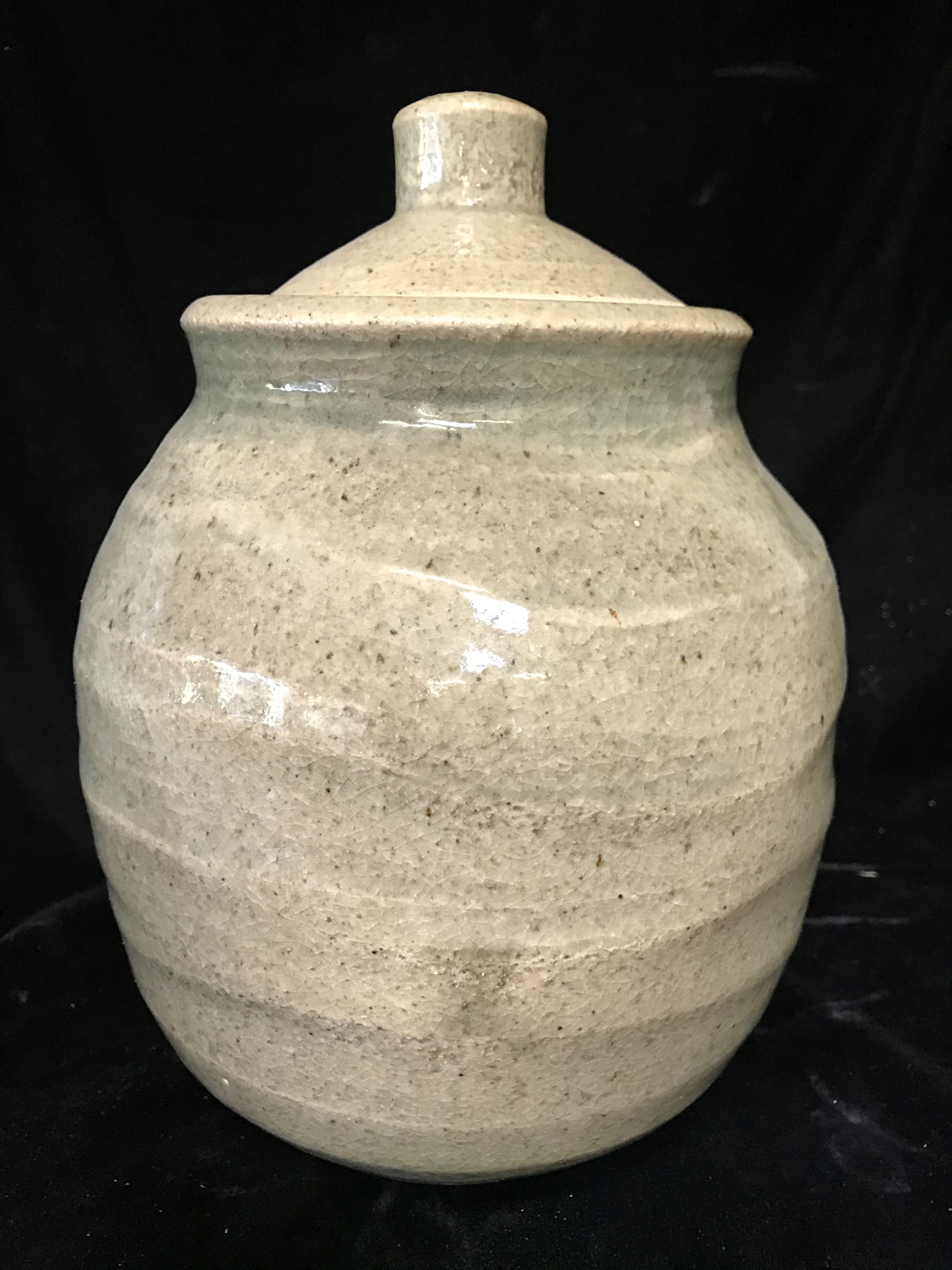 Jar - over irregularly thrown body with light Celadon glaze